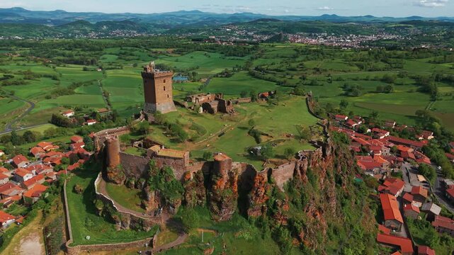 Aerial shot around Polignac fortress on a sunny day near le Puy en Velay in Haute Loire departement, Auvergne RH&ocirc;ne Alpes region, France