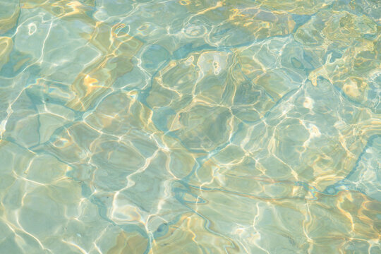 blue water ripple surface background; swimming pool tiles