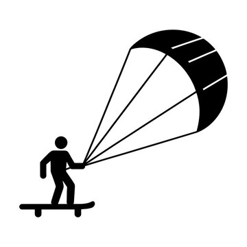 Man on skateboard with parachute