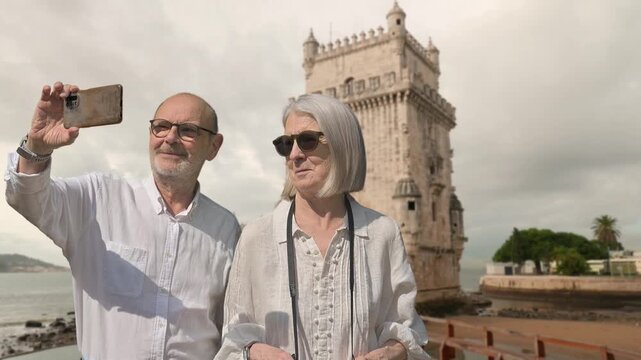 Senior Couple Taking Selfie in Front of Historic Bel�m Tower, Lisbon