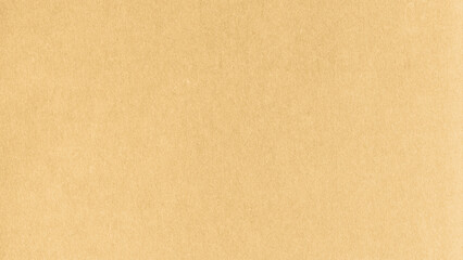 Fototapeta premium Vintage brown cardboard texture background. Recycled kraft paper pattern with an old grunge cardboard surface