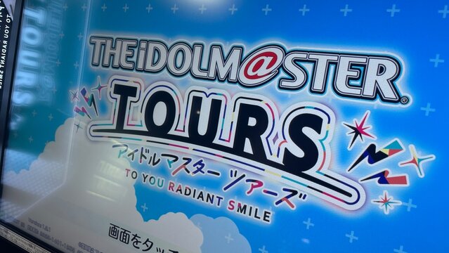 The Idolmaster Tours arcade game title screen advertisement featuring colorful logo at Kushida Dental Clinic near Osaka city - Osaka, Japan, August 5, 2025