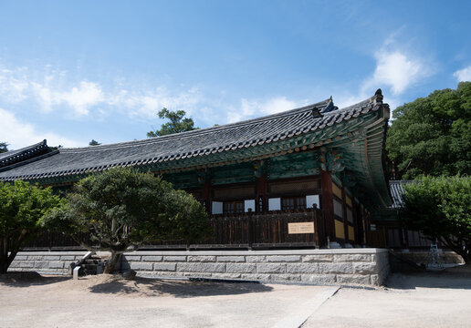 Yangsan, Gyeongsangnam-do, South Korea - May 15 2026: Traditional wooden pavilion and tiled roof of Tongdosa Temple under a bright blue sky with light clouds