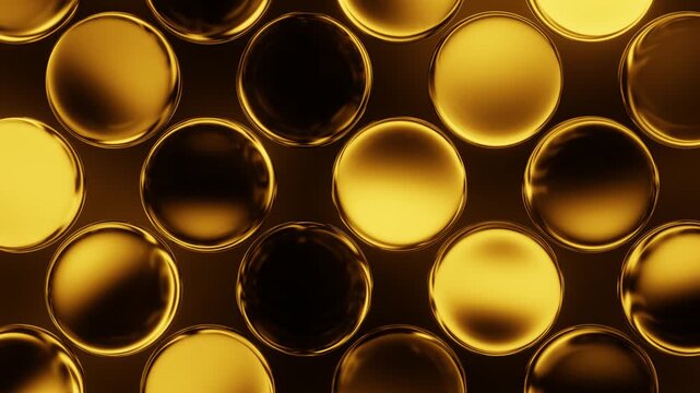 Golden spherical shapes illuminating and dimming in a seamlessly looping animated pattern background