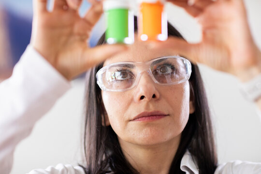 scientist female controlling sample in a laboratory