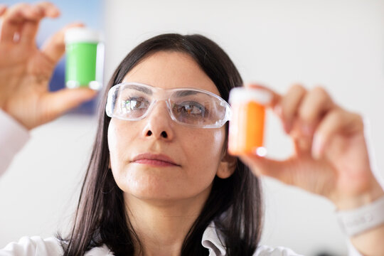 scientist female controlling sample in a laboratory