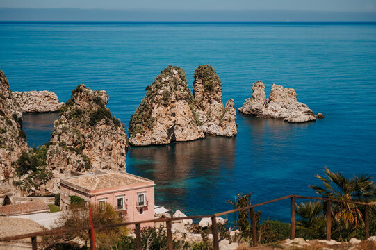 Faraglioni di Scopello sea stacks above turquoise Mediterranean waters