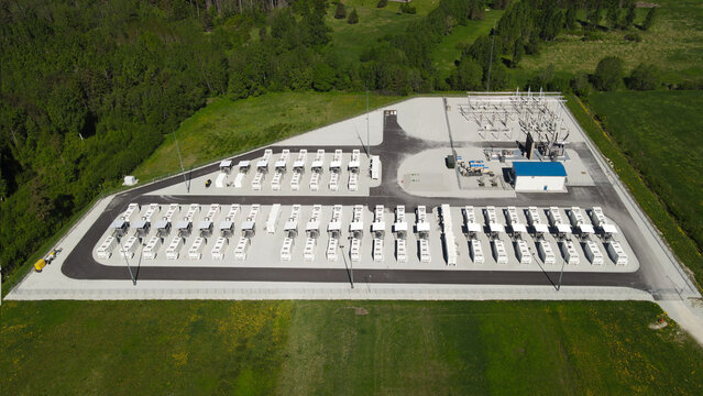 Large scale battery energy storage system at an electrical substation enabling renewable integration and grid resilience, sunny aerial view of Kiisa, Estonia facility