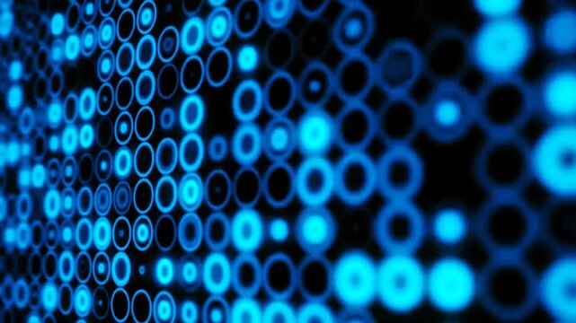 Abstract futuristic background featuring blinking neon blue digital circles and dots pattern on dark background. Perfect for technology, sci-fi themes, data visualization, and modern VJ loops.