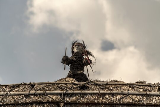 Figure on the roof of a thatched wooden house, Ngada village Guru Sina, Bajawa, Flores Island, Indonesia