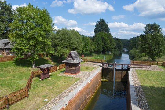 Lock with neighbouring river, surrounded by trees and blue sky with clouds, Mikasz&oacute;wka lock, Kanał Augustowski, August&oacute;w canal, Augustow, canal, Mikasz&oacute;wka, Mikaszowka, Powiat Augustowski, Podlaskie Voivodeship, Poland