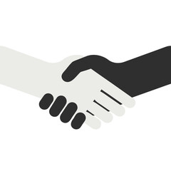 Fototapeta premium Two hands, one black and one white, shaking in agreement