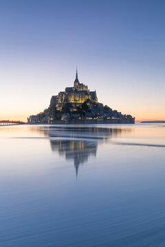 France, Normandy, view to lighted Mont Saint-Michel, blue hour