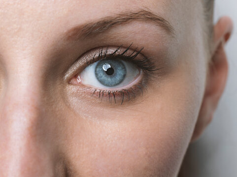 Close-up of blue eye of a young woman