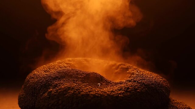 Smoldering coal embers glowing brightly hot.