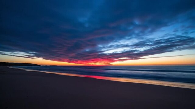Mesmerizing time-lapse of a colorful sunset over a serene beach with gentle ocean waves