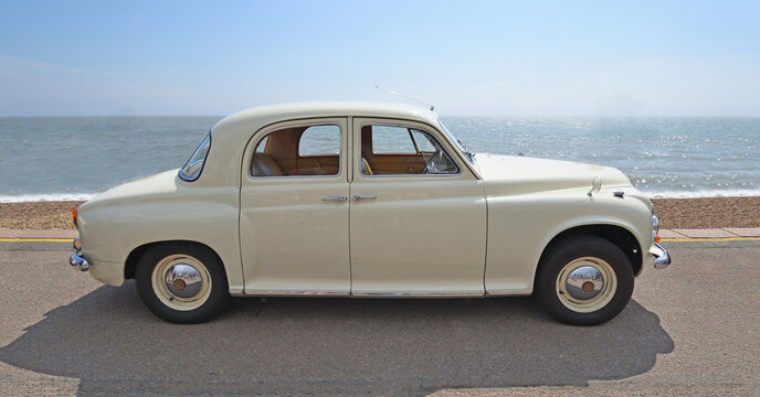 Classic Rover P4 Saloon parked on seafront promenade beach and sea in background
