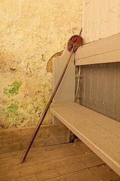 Church collection bag (also known as an offertory bag or alms bag) attached to a long wooden pole, Saaremaa, Estonia, Europe.