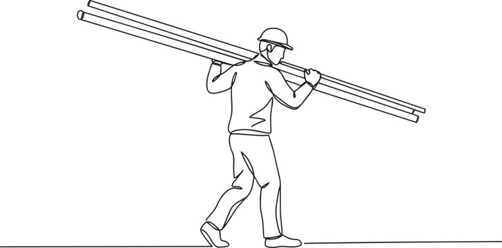 Construction worker carrying materials on his shoulder, walking forward.