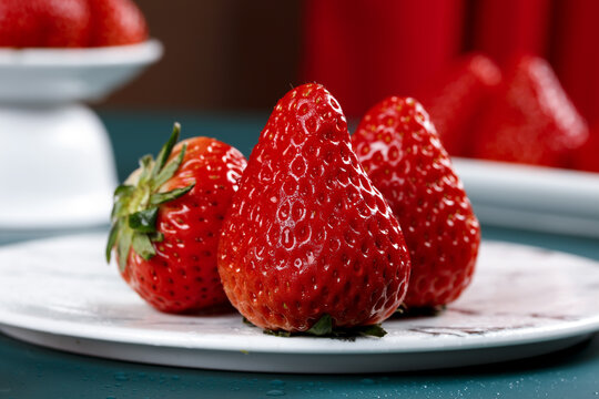 Fresh Ripe Strawberries on White Plate - Healthy Vitamin Rich Fruit for Refreshing Breakfast and Desserts