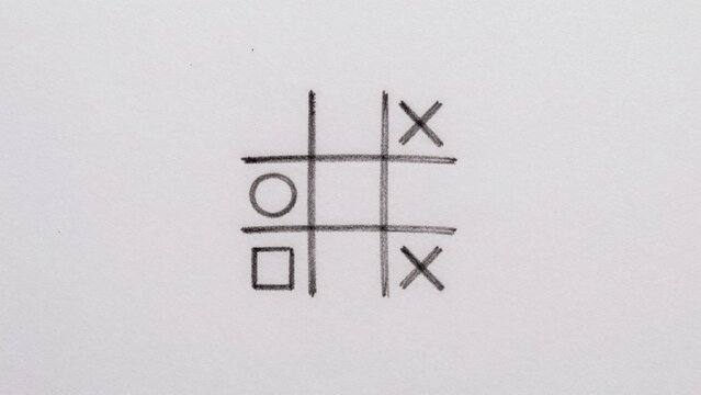 Simple hand-drawn tic tac toe game consists intersecting squares each containing horizontal line top bottom fo