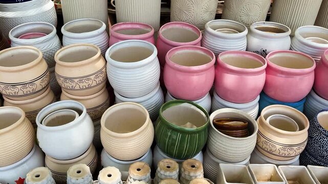 colorful ceramic flower pots displayed at outdoor garden planter market stall