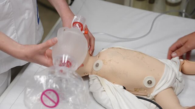 Healthcare Professional Providing Respiratory Support to Newborn Simulation Patient
