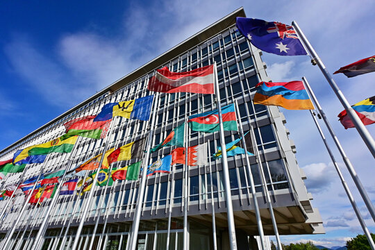 Geneva, Switzerland, Europe - 05.2026 : National flags of members of World Health Organization in front of headquarters building, specialized agency of United Nations