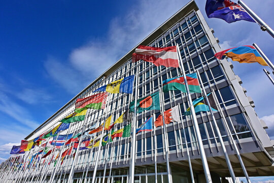 Geneva, Switzerland, Europe - 05.2026 : National flags of members of World Health Organization in front of headquarters building, specialized agency of United Nations
