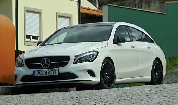 White Mercedes-Benz CLA Shooting Brake parked on street