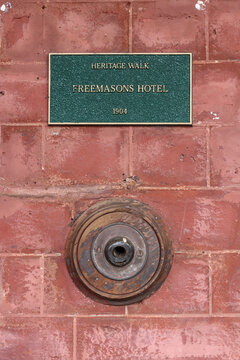 Heritage walk, bronze and green plaques on buildings of historic interest, Bridgetown, Western Australia. Small town travel destination, tourism. Freemasons Hotel, 1904