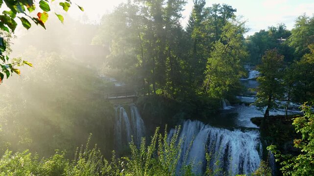 Panning shot of Flowing River Waterfall in Rastoke Village