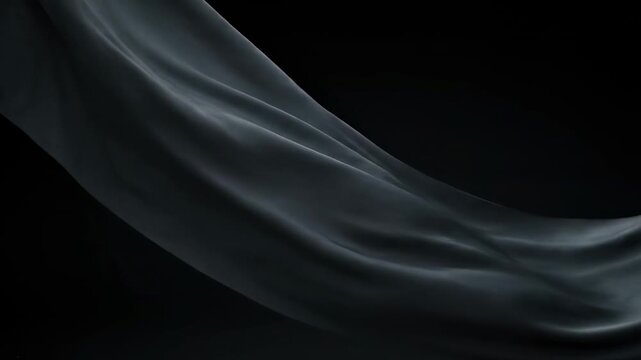 Flowing fabric in grayscale against a dark background, creating gentle curves