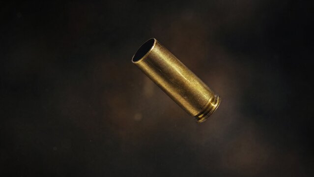 ejected. Single brass cartridge case ejected from an antique revolver, isolated on dark background. mobility guides, transit brochures, designed for mobility and urban transit guides.