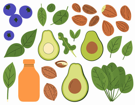 A colorful arrangement of healthy foods including avocados, almonds, blueberries, and greens