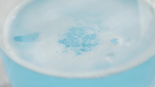 Effervescent tablet in a clear glass, liquid medication solution for pain. Pain reliever. High quality 4k footage