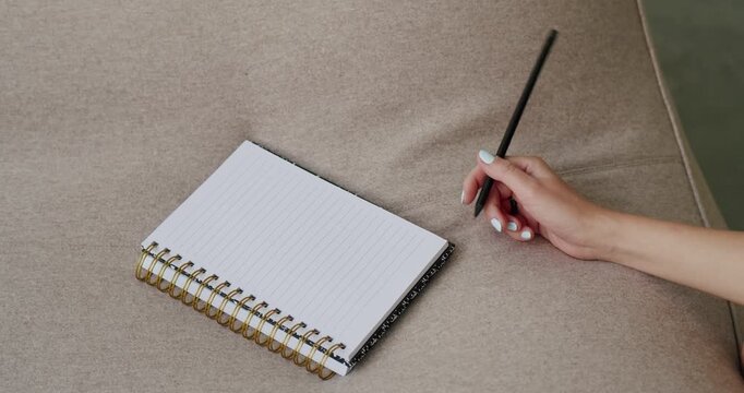 woman writing, female hand, notebook page, handwriting, journal entry, pen paper, study notes, diary writing, academic notes, written text, school notebook, creative writing, personal journal, writing