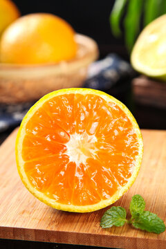 Fresh Cut Orange from Zigui Hubei China Showing Juicy Vitamin Rich Flesh on Wooden Board Summer Fruit