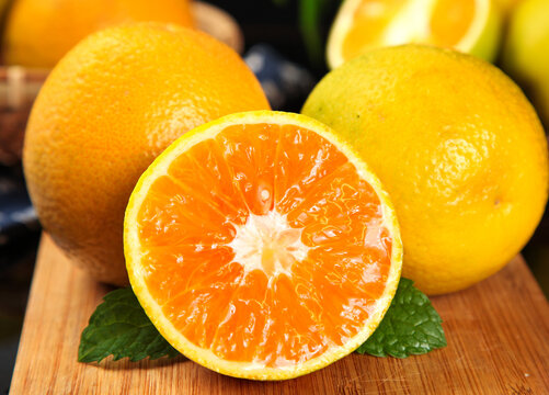 Fresh Hubei Zigui Oranges Cut in Half Showing Juicy Orange Flesh Rich in Vitamins