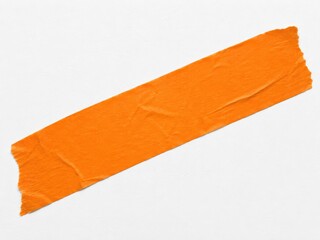 Single piece of torn orange masking tape diagonally on white background.