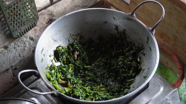 Water spinach saag stir fry cooking in kadai