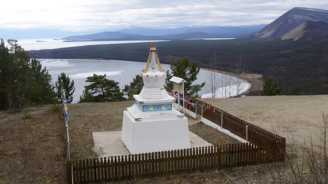 Severobaikalsk, Russia - May 10, 2025: Buddhist stupa on the shore of Lake Baikal in early spring.