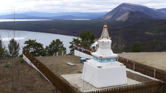 Severobaikalsk, Russia - May 10, 2025: Buddhist stupa on the shore of Lake Baikal in early spring.