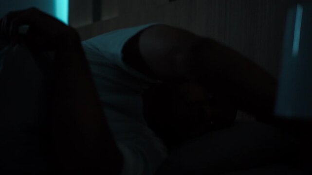 Concerned middle-aged man sleeping peacefully in comfortable bed at home. Sleep well, sweet dreams, deep sleep, relaxation, healthy lifestyle, wellness and bedtime comfort concept.
