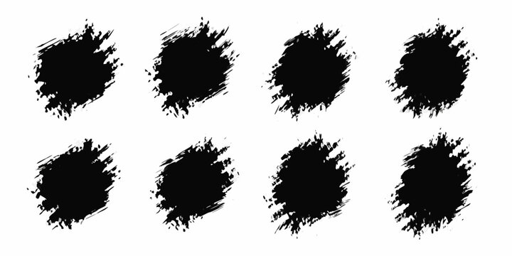set of eight black grunge ink splatters on white background splatter texture