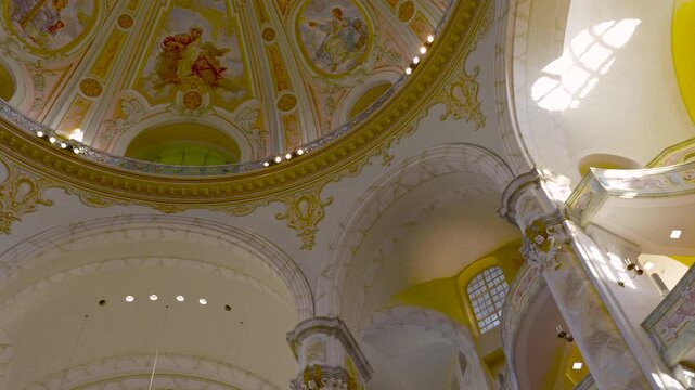 Ornate frauenkirche interior and golden pipe organ. Majestic interior view of the frauenkirche in dresden, germany, revealing the beautifully painted dome, baroque architecture