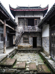 Fototapeta premium Traditional Chinese Courtyard with Classical Architecture and Curved Roofs