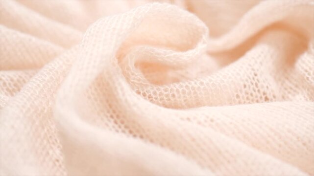 Soft Wool knitted mohair background. Light pastel Alpaca wool clothes texture closeup. Cashmere Soft and fluffy merino wool macro shot. Top view woolen fabric backdrop. Rotating