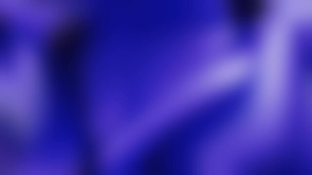 Abstract motion background animation featuring a seamless loop of blurry soft liquid gradients in vibrant shades of dark blue and purple colors.