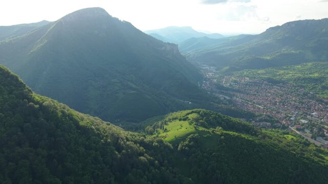Beautiful drone footage capturing panoramic view of Teteven with dense green trees and high mountain ridges. Scenic Bulgarian nature landscape ideal for travel, adventure, eco tourism, and outdoor exp